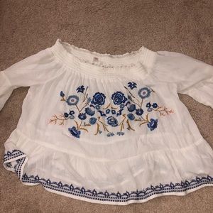 off shoulder white shirt with blue flowers